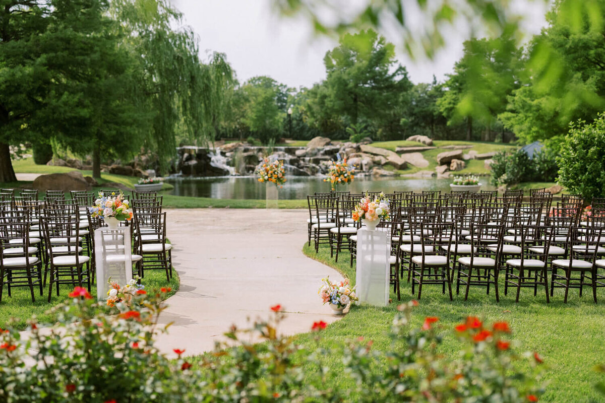 coles-garden-waterfall-ceremony-orange-flowers