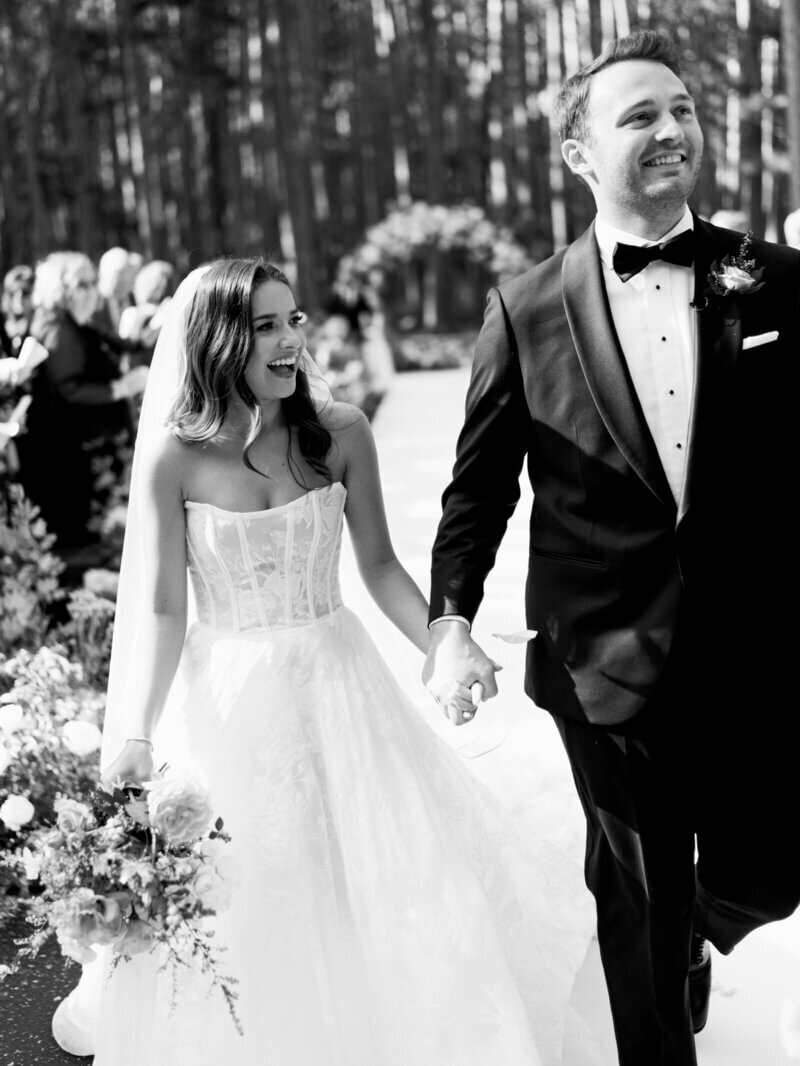 Bride and groom walking down aisle planned by wedding planners in chicago
