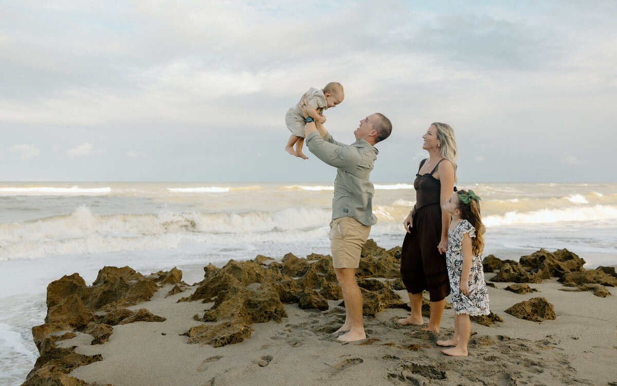 family play on the beach in south florida