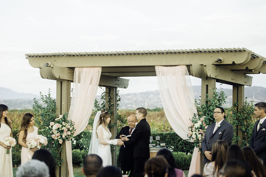 Wedding Photograph Of Groom Reciting His Vow While Giving The Ring To His Bride Los Angeles