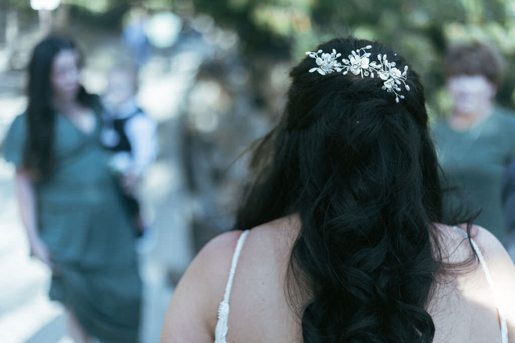 A person walking towards their wedding guests.