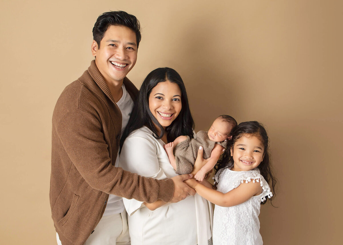 Family of 4 at a newborn photoshoot in Los Angeles