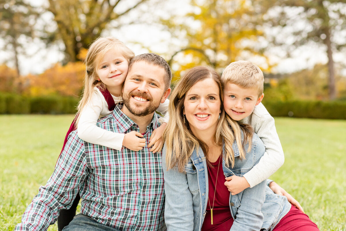 Smile sandwich of mom and dad and kids