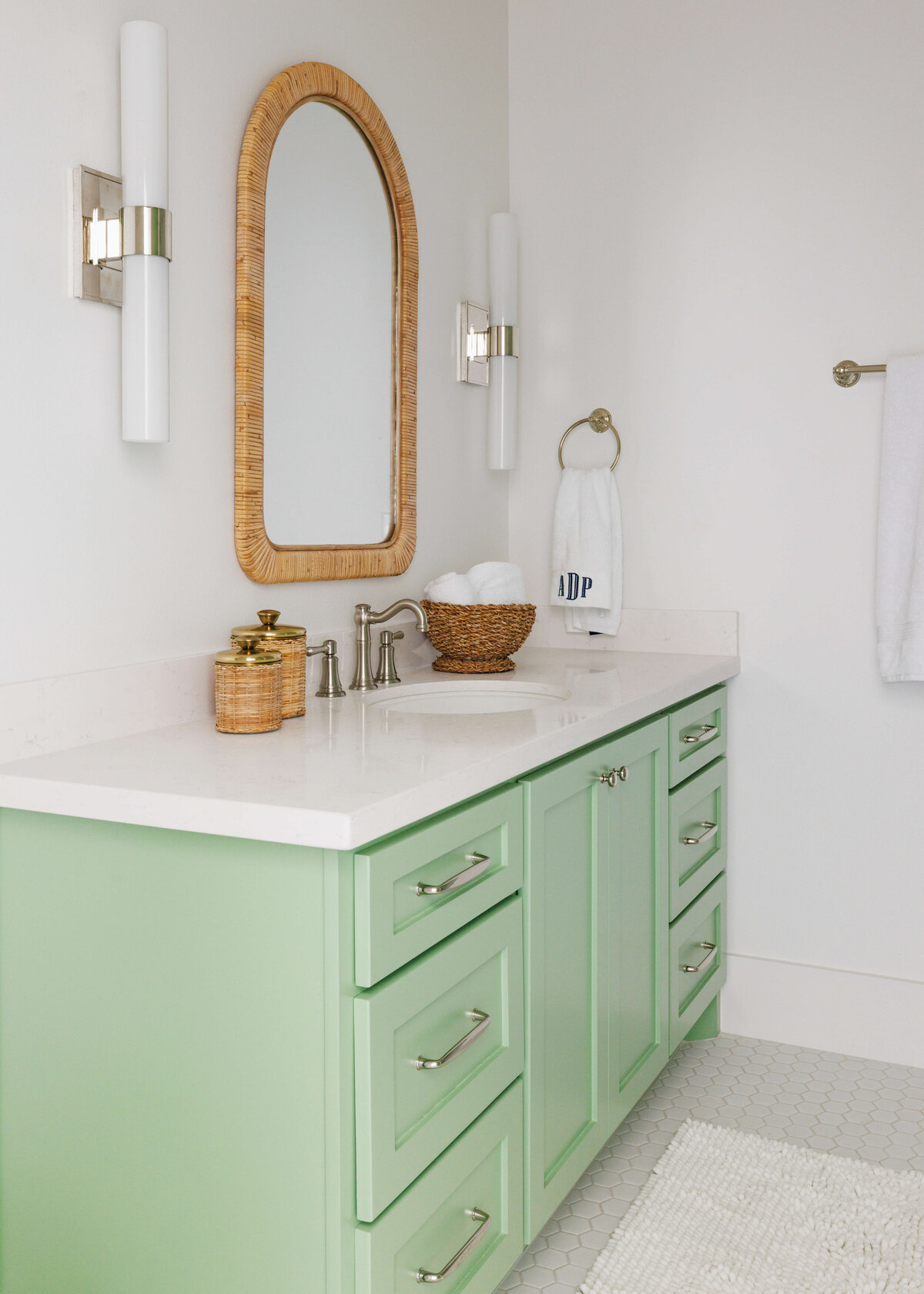 oyster creek studios lighthouse on the lake light green vanity with white countertops and wooden mirror in bathroom
