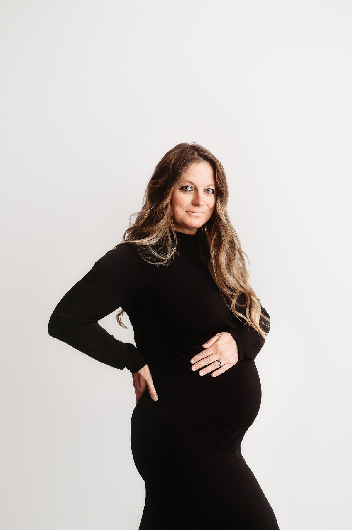 Pregnant woman poses for Studio Maternity Photos in Asheville.