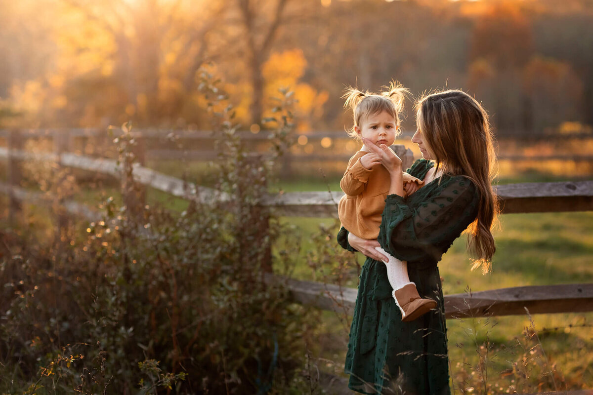 Portrait photographer Kristine Esposito captures mom touching daughter's cheek