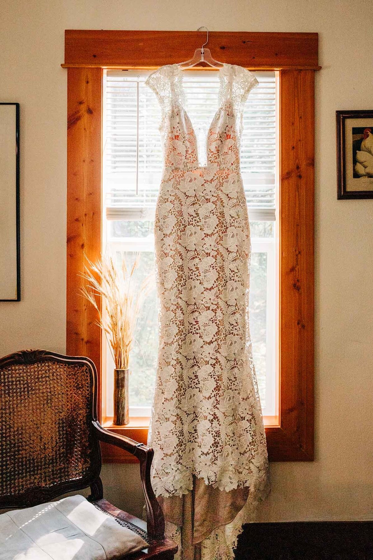 Lace wedding dress hanging in window, Izaak Walton Inn, Essex, MT