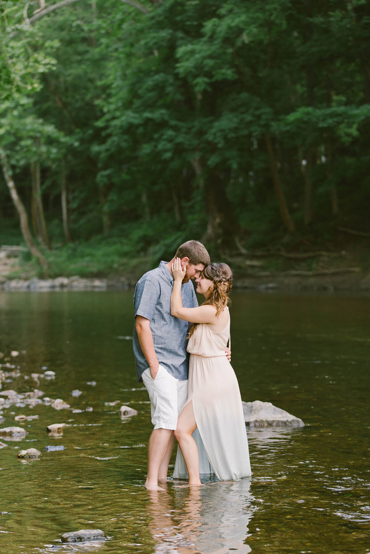 engagement portraits taken in a lake