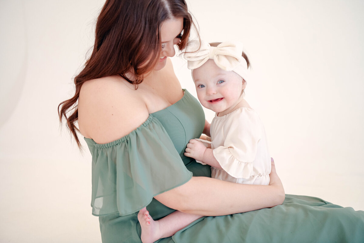 Mother and daughter with down syndrome  posing at session.