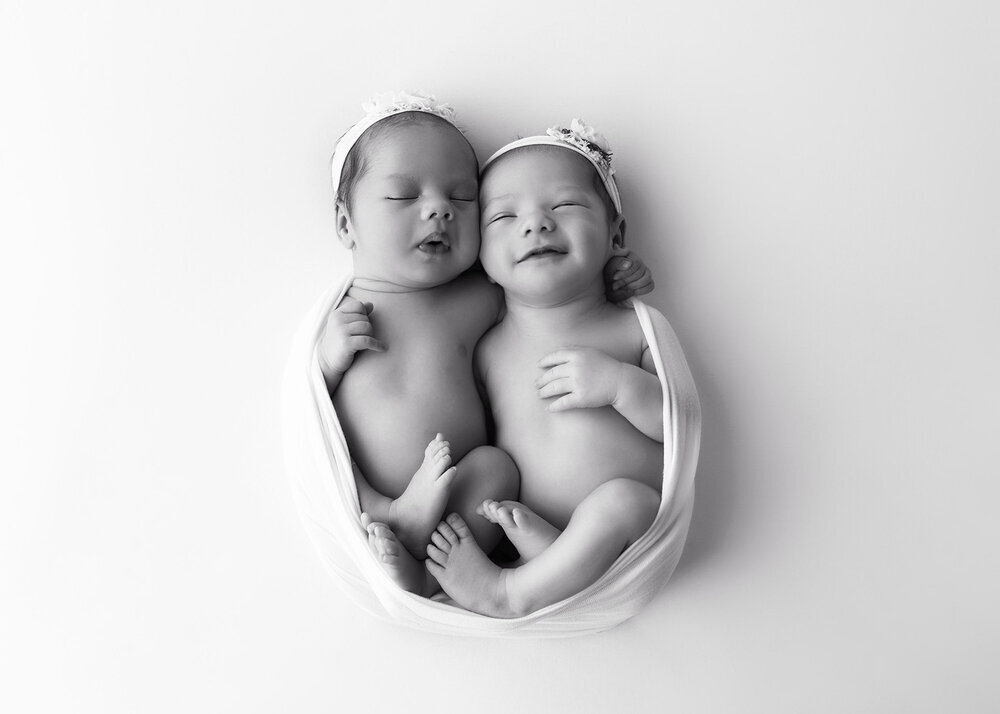 NEWBORN_BABYGIRLSTWINSWRAPPEDSMILE