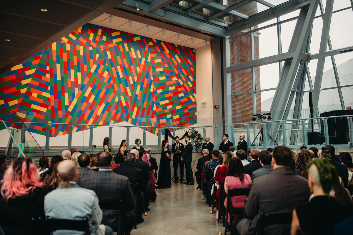 Vows are exchanged inside the colorful and modern space at AAM.