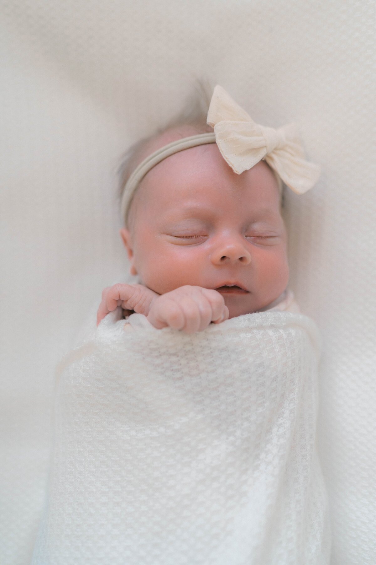 White nursery filled with natural light—newborn photography Salt Lake City style at its softest.