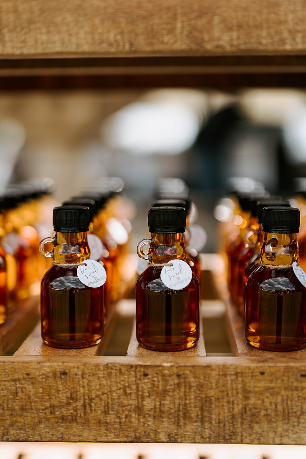 upstate new york maple syrup mini bottles displayed for wedding favors