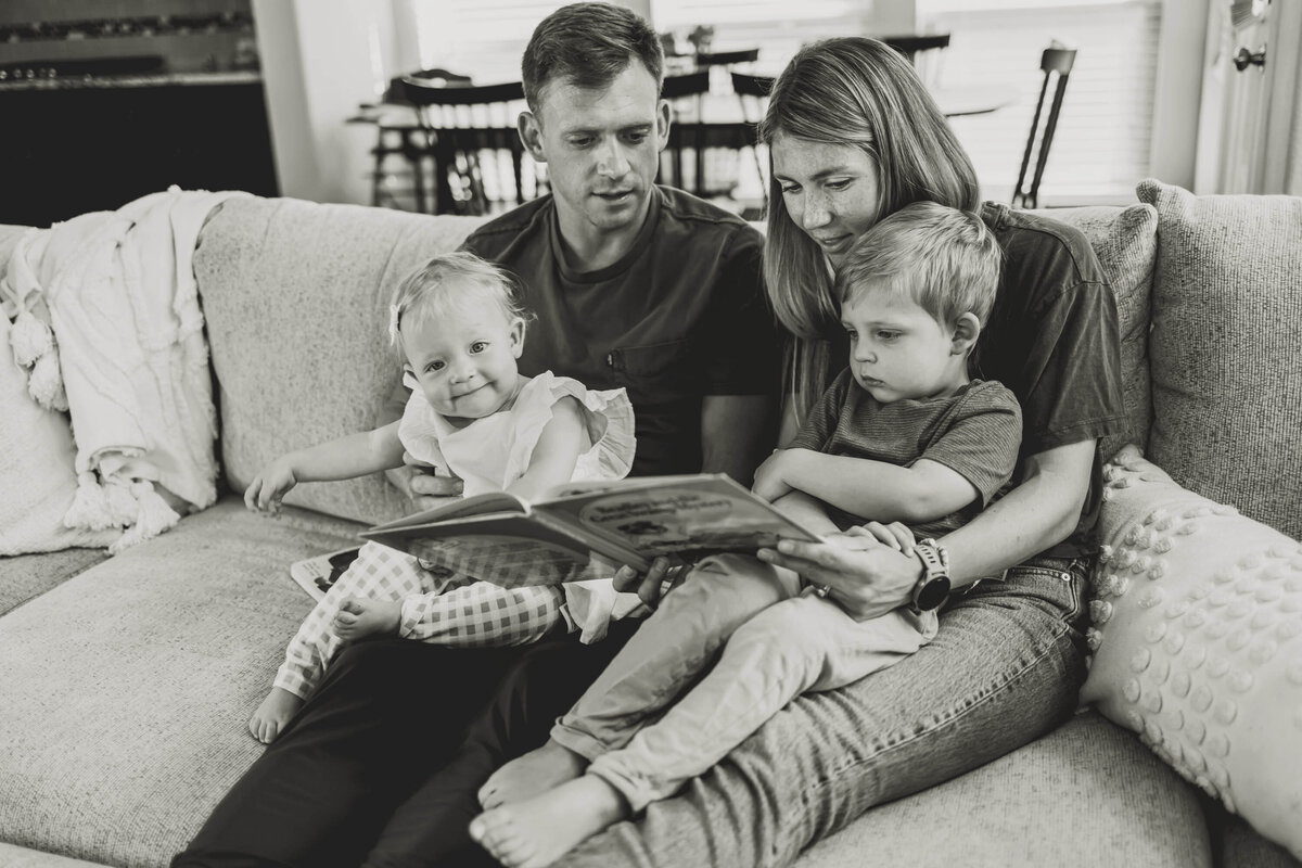 a family sits together to read at an in home session in carrollton texas