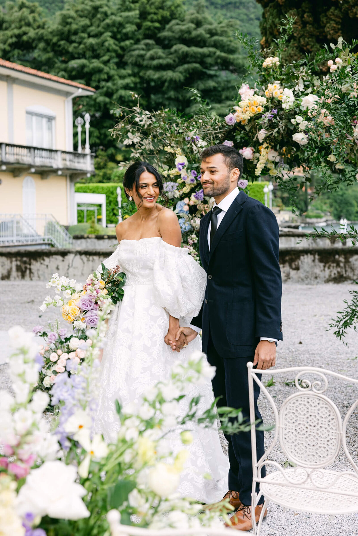 A wedding day photo of the bride and groom at Villa Aura del Lago on Lake Como in Italy