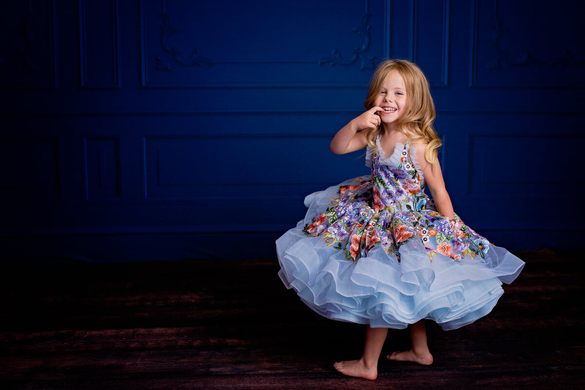 Cute little girl in couture Bentley and Lace dress posing in Prescott kids photography session by Melissa Byrne