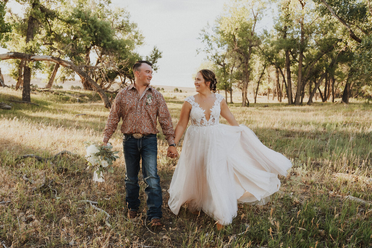 Couple outside holding hands during their Colorado wedding photographer