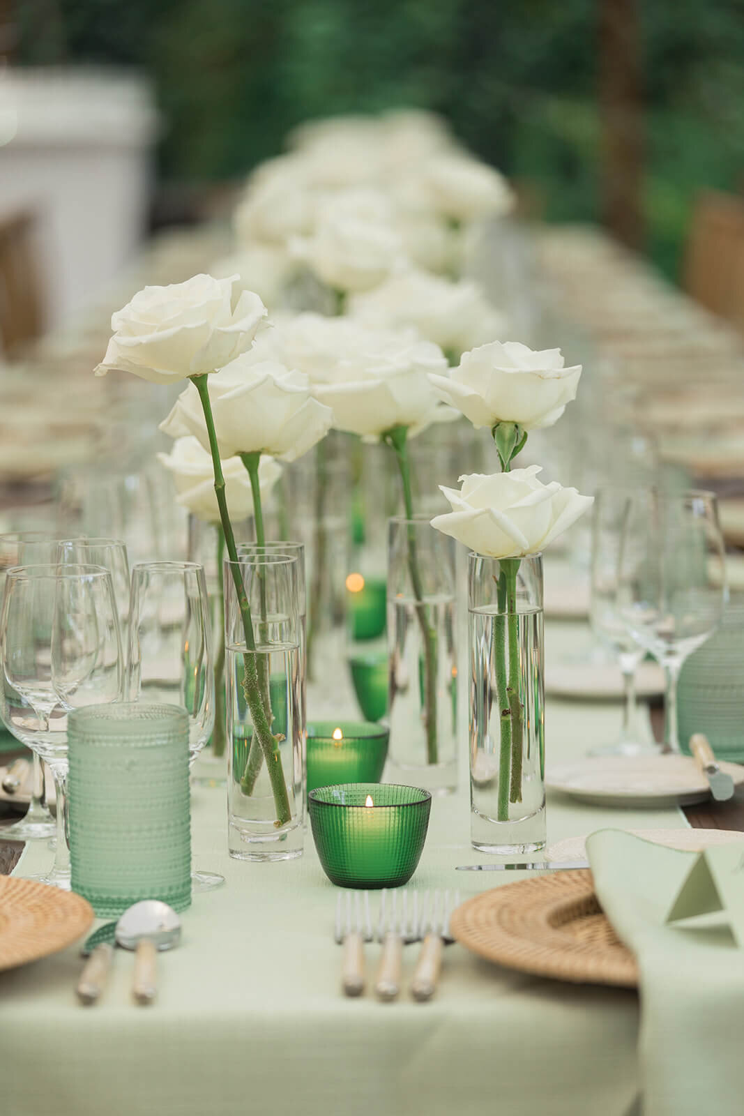 Wedding table scape with green linens and glassware