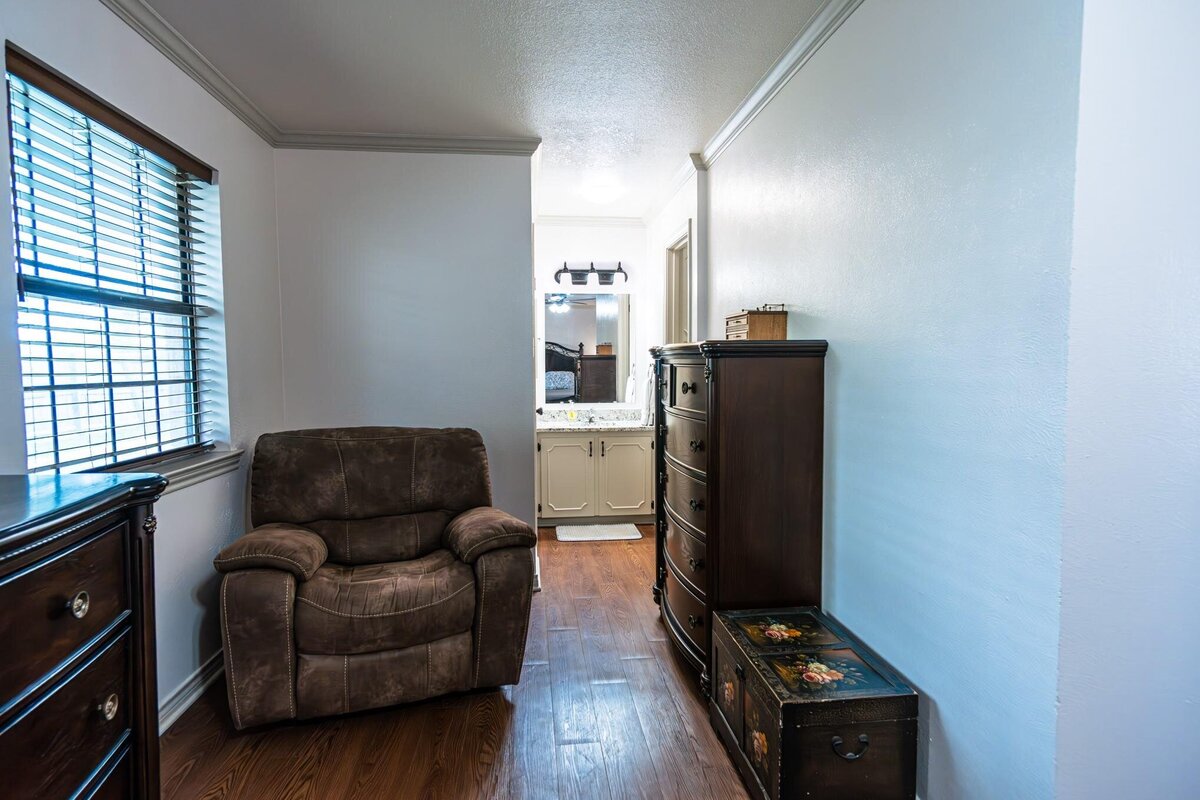 primary bedroom sitting are of Charming 3 Bedroom 2 Bath Home with Upgrades for sale in Bonham, TX