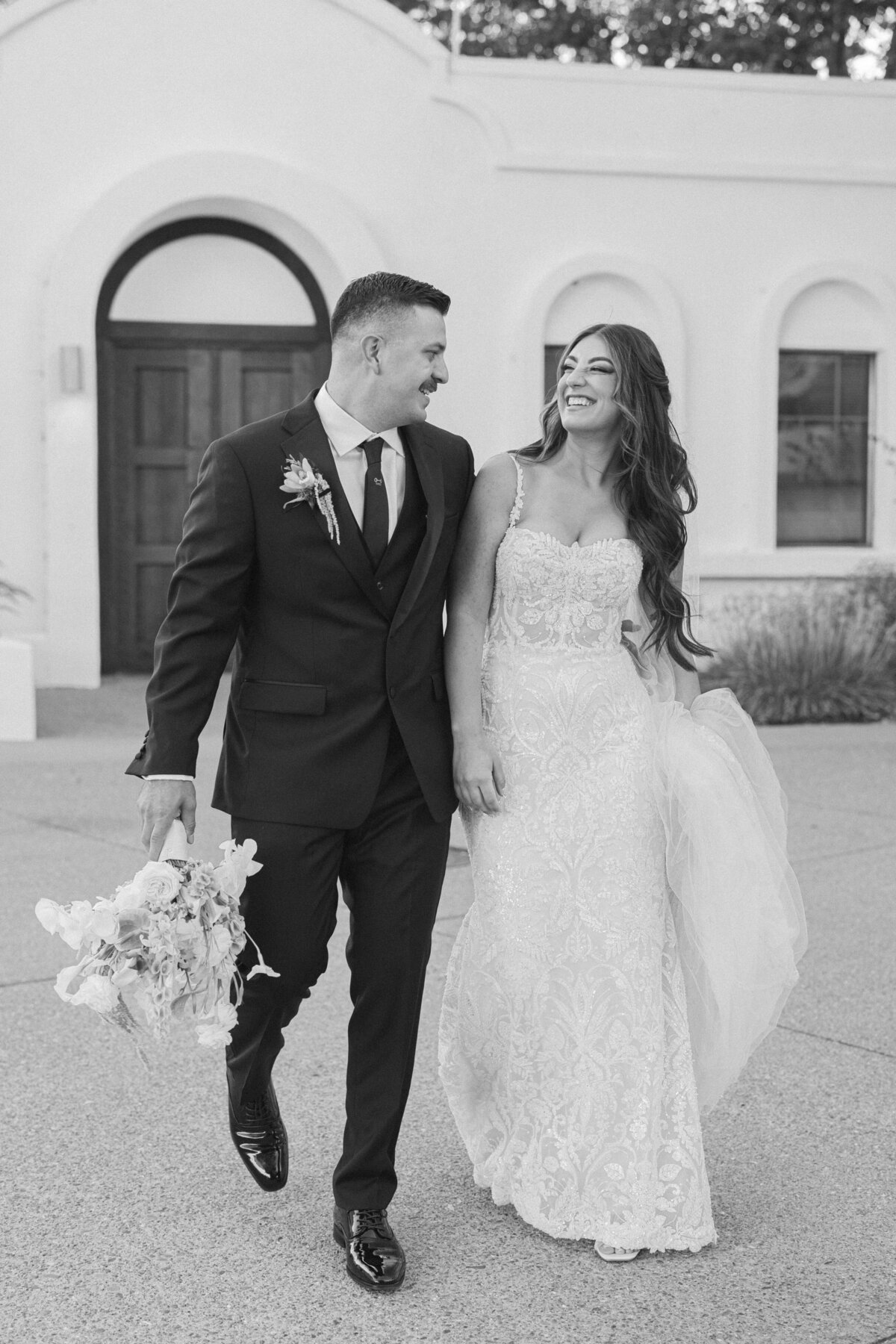 Bay Area wedding photography, black and white documentary style image of bride and groom laughing 