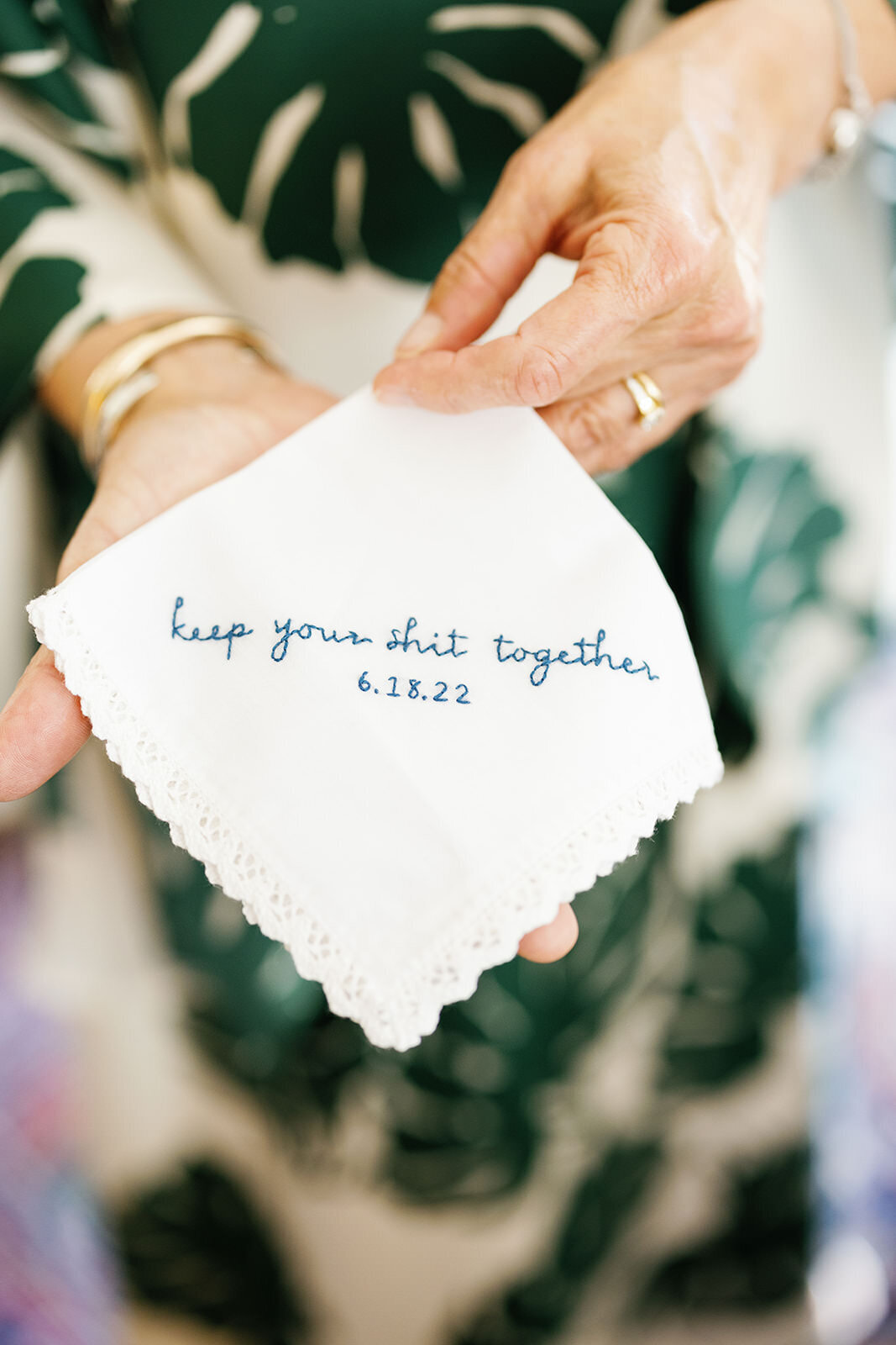 Small napkin embroidered with 'keep your shit together'