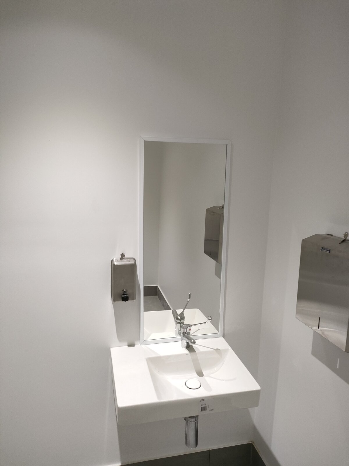 Residential bathroom showcasing a custom vanity mirror for functionality and style.