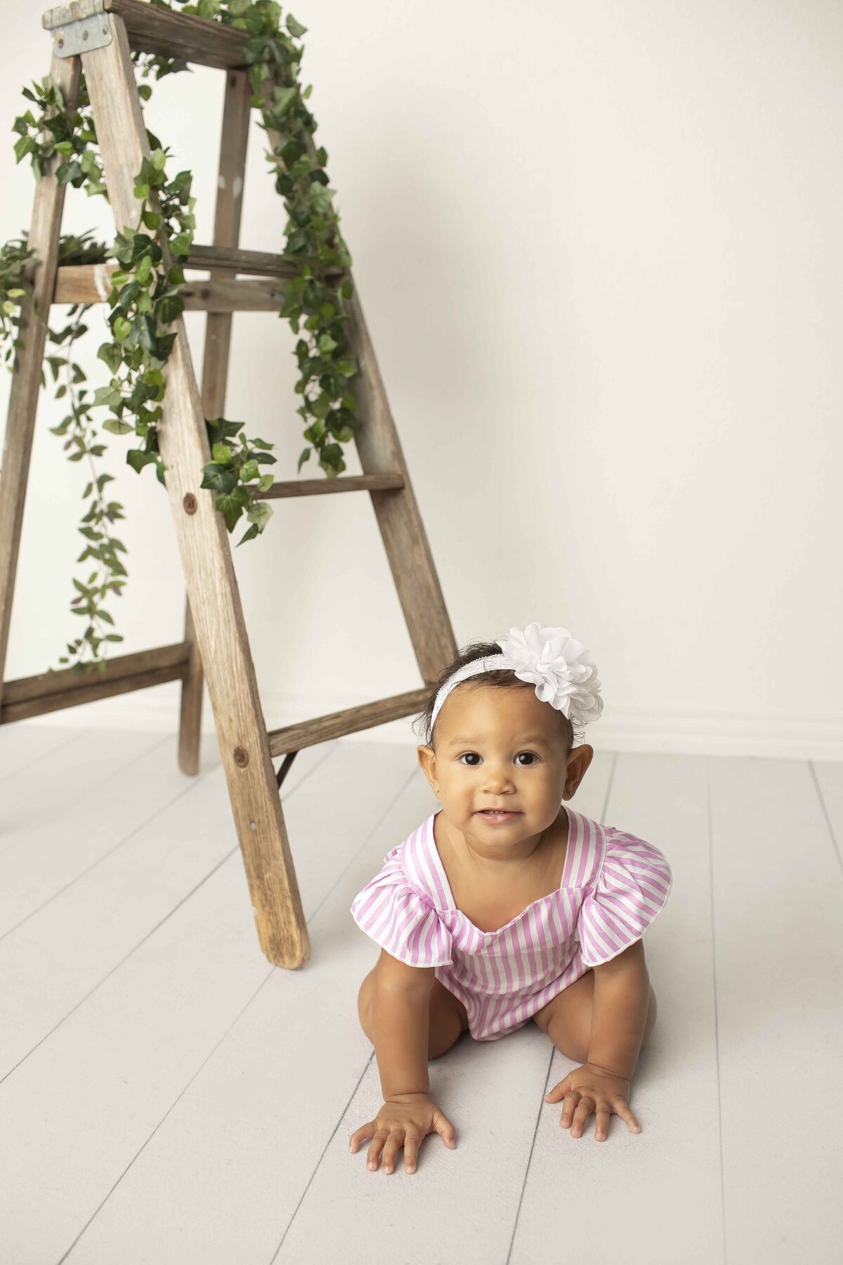 A bundle of joy at 6 months old, exploring the world with wonder and giggles in this milestone photoshoo