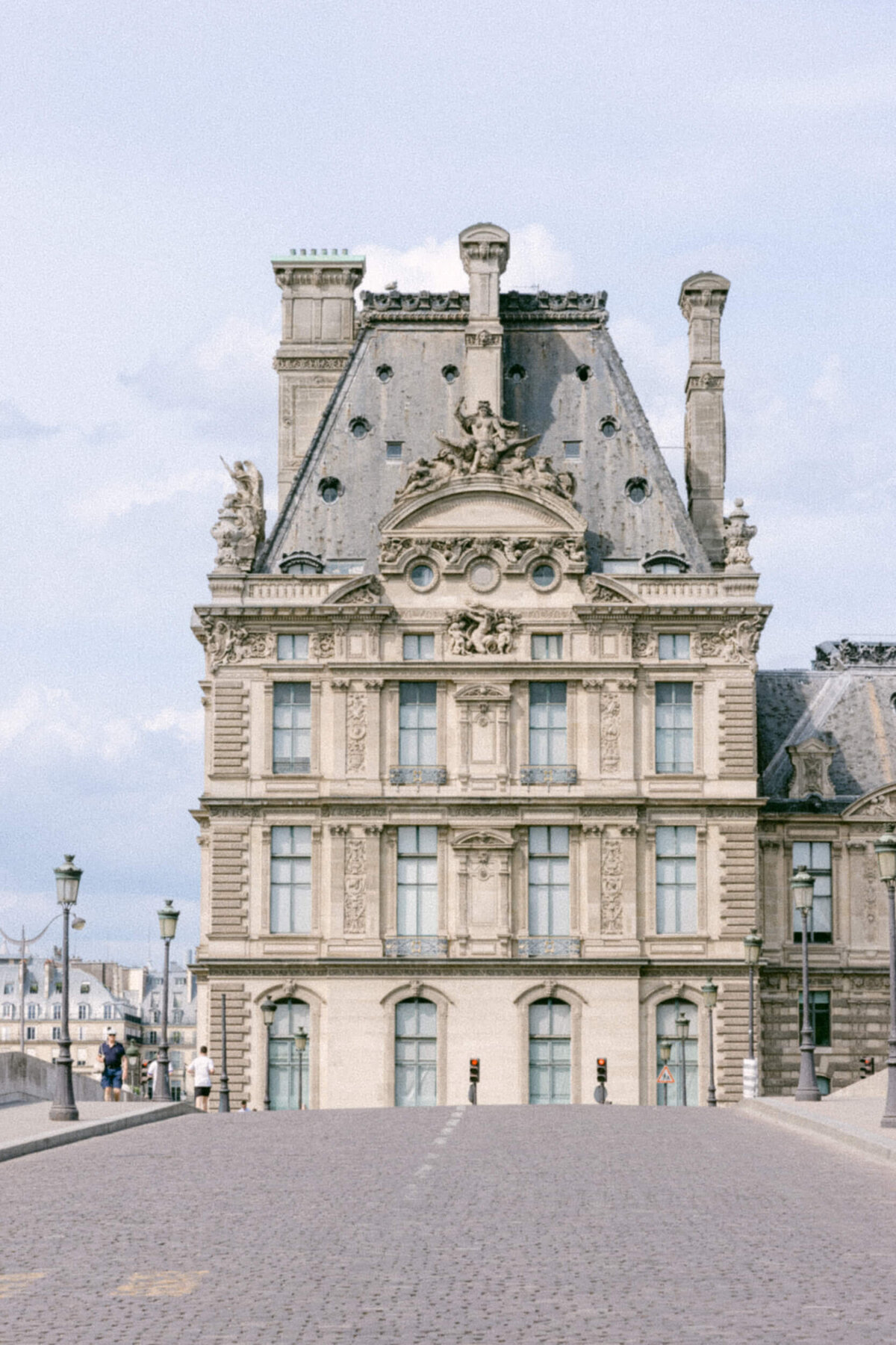 A wedding photo showing off the architecture of Paris