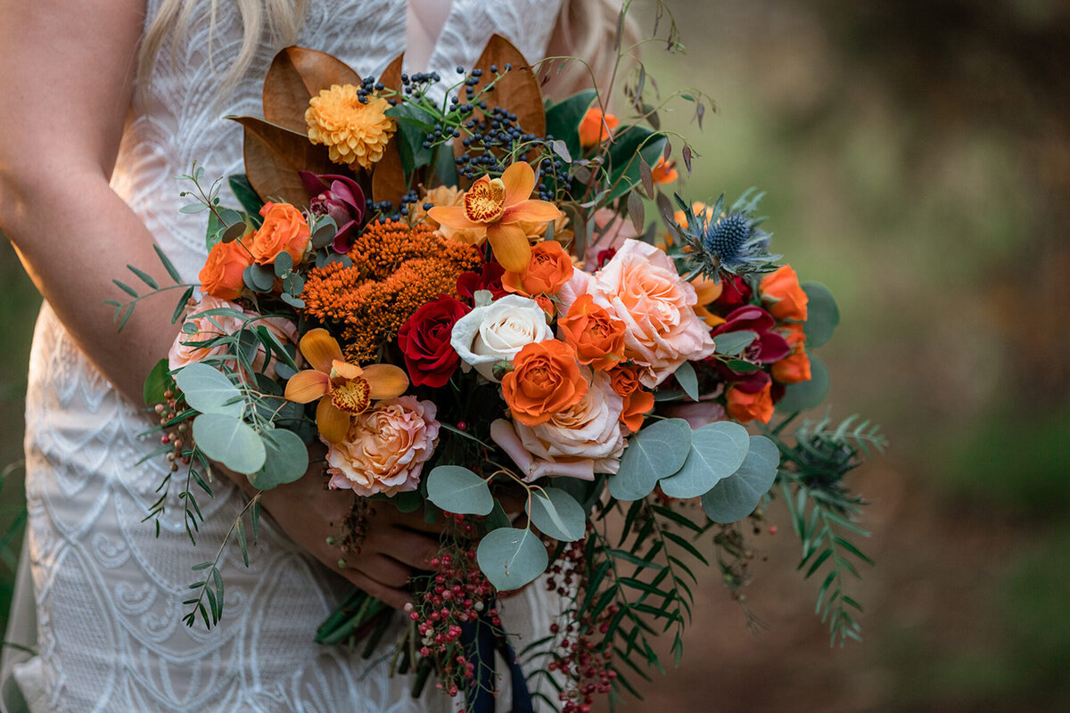 Colourful fall inspired wedding bouquet by Flower Aura By Natasha, classic Calgary, Alberta wedding florist, featured on the Brontë Bride Vendor Guide.