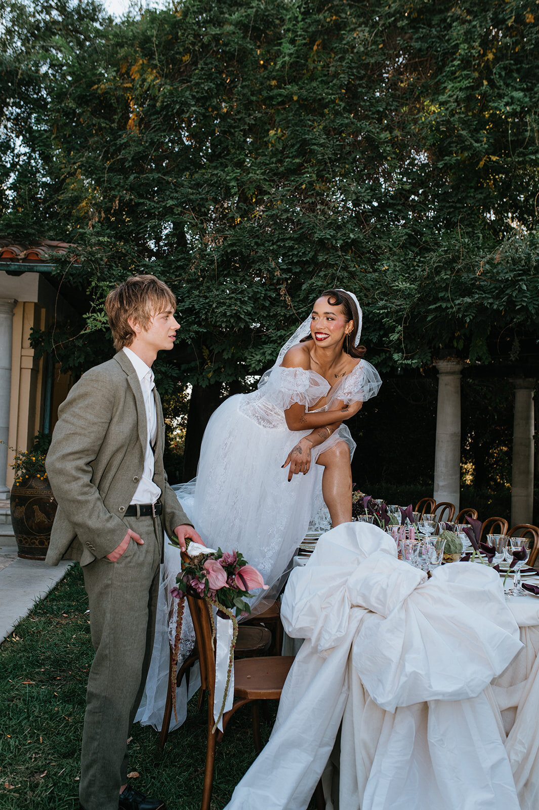 Bride-smiling-standing-on-table