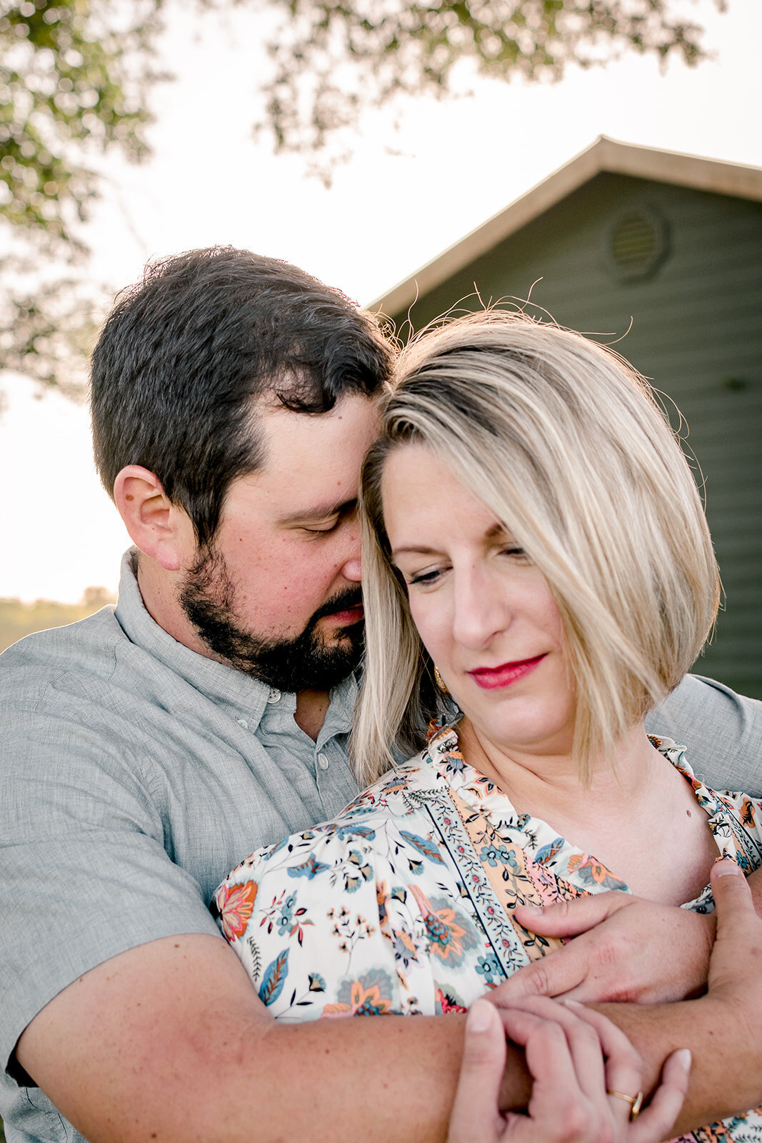 A romantic snuggle between husband and wife.