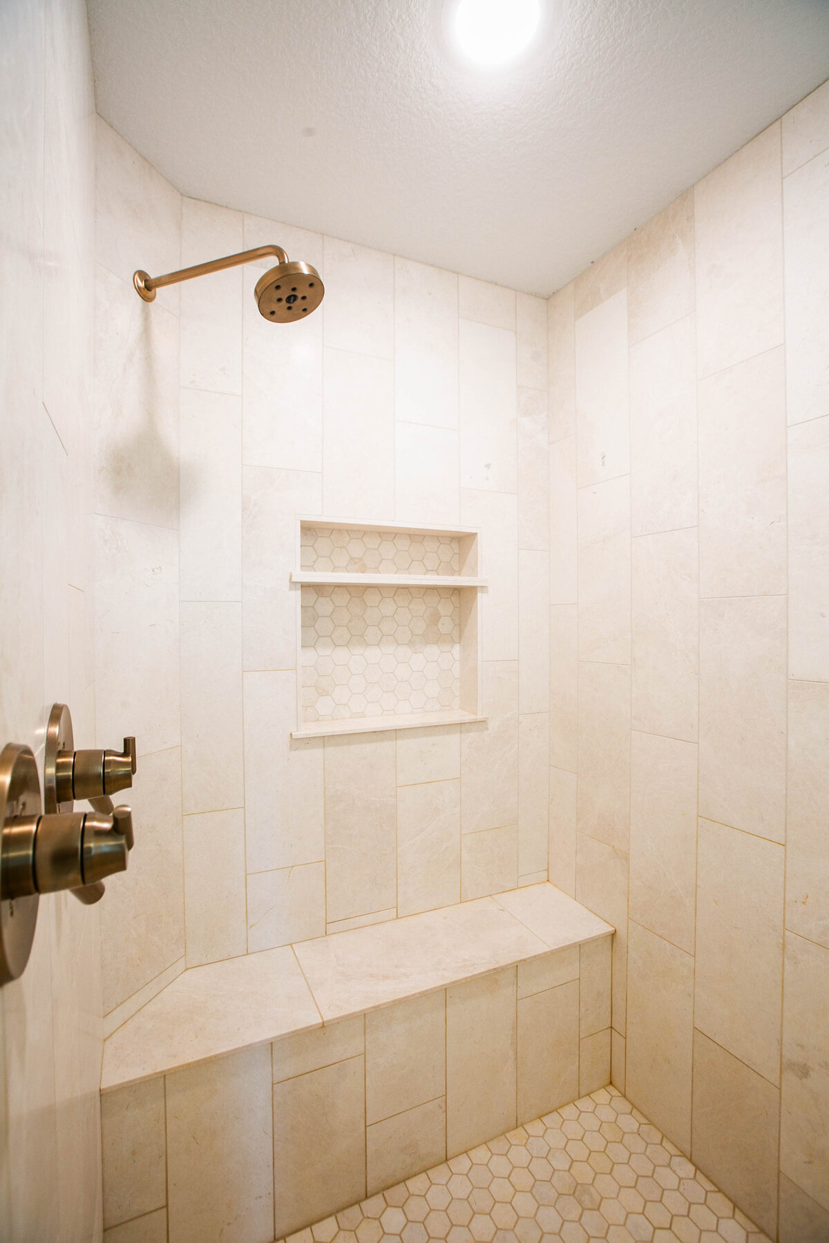 Custom bathroom with soaking tub, double vanity, and walk-in shower in Otsego custom home