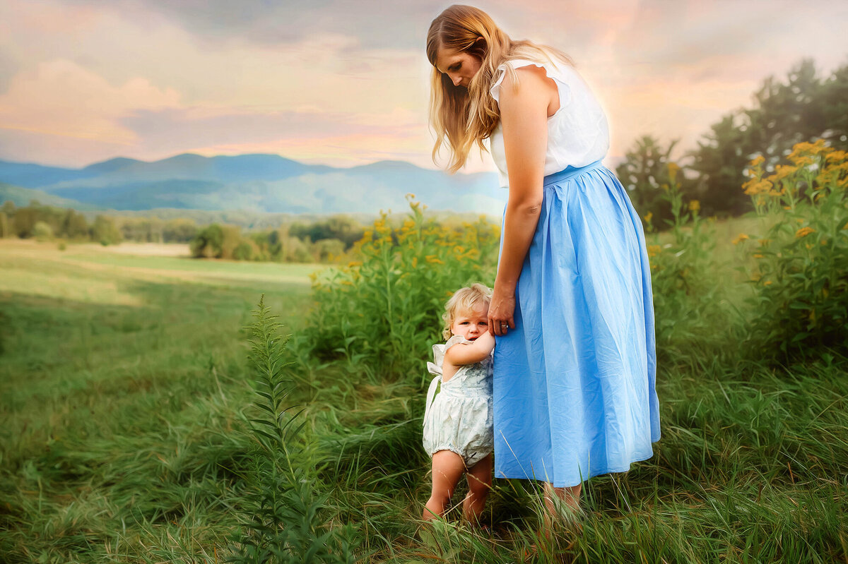 Mother embraces her daughter during Family Photoshoot n in Asheville, NC.