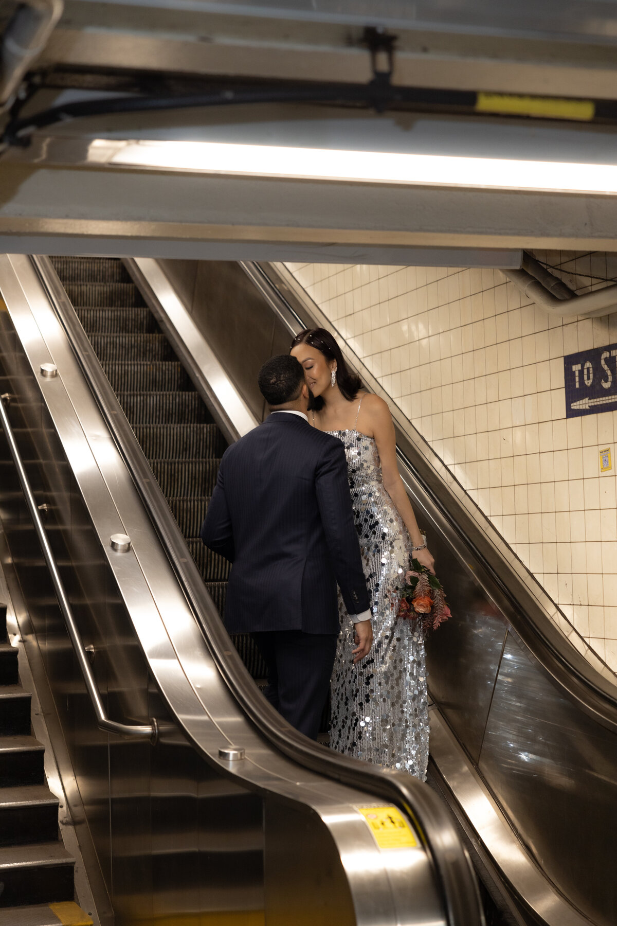 Modern, urban editorial elopement session on the NYC subway, capturing bold style and romantic vibes.