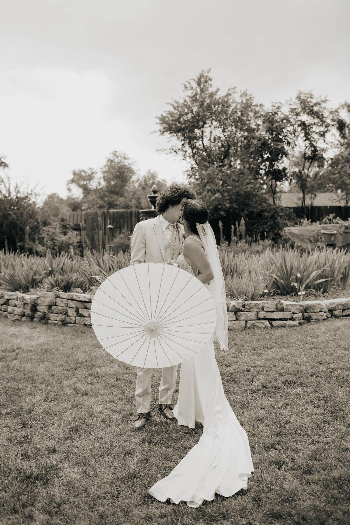 wedding parosol bride and grrom photo