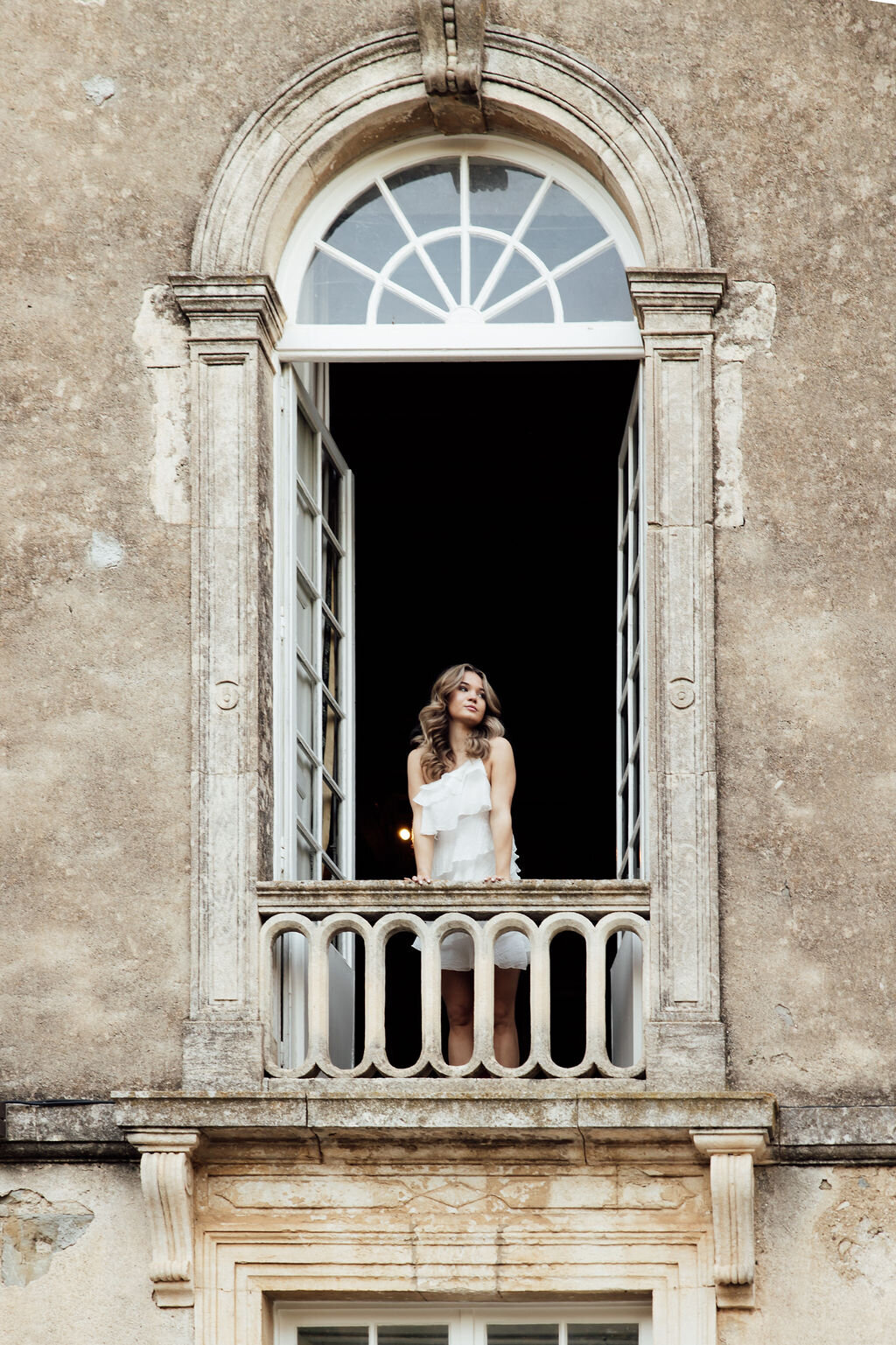 refined-bride-at-window-chateau-d-agel