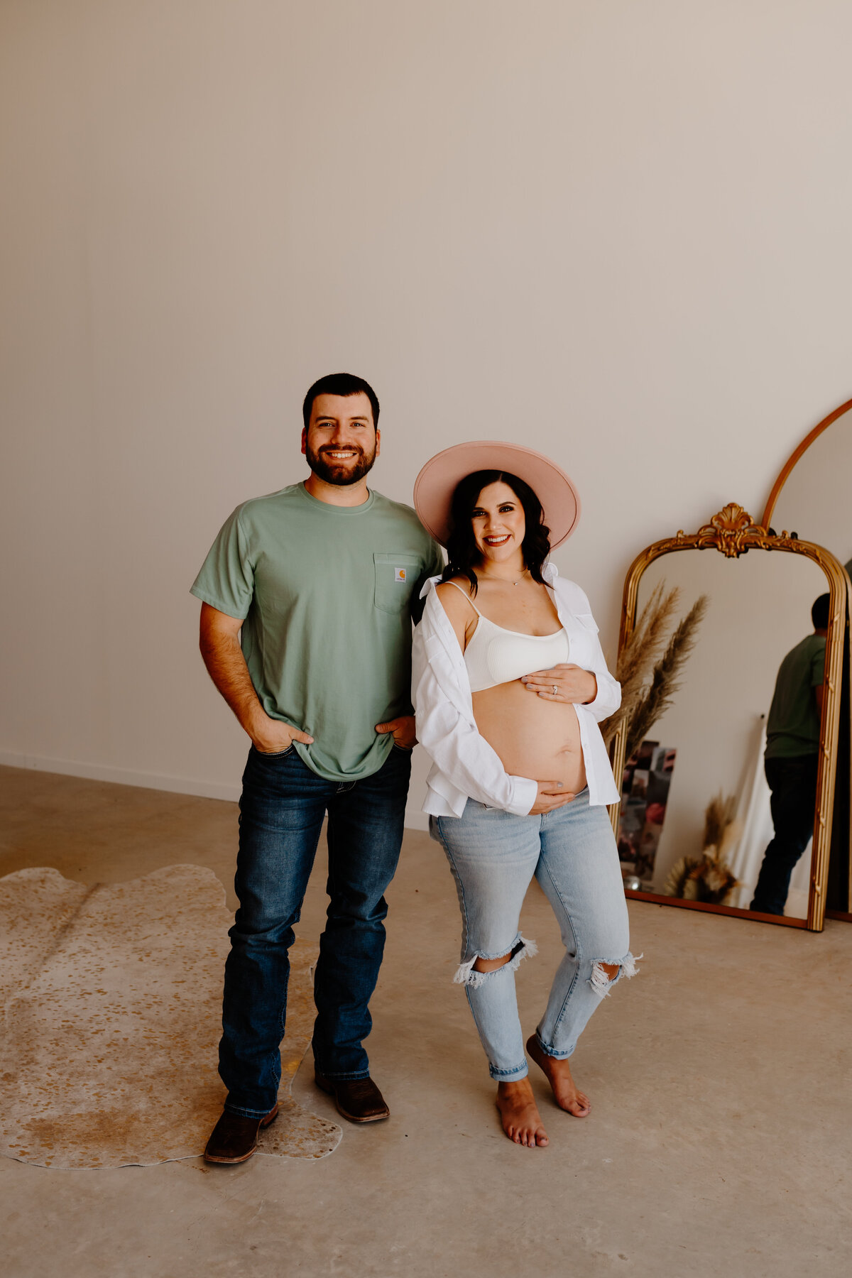 couple posing with baby