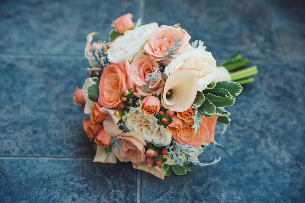 Floral Wedding bouquet with orange and white colors.