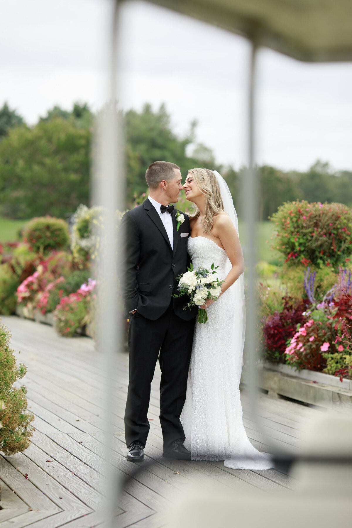 bride and groom posing for their portraits