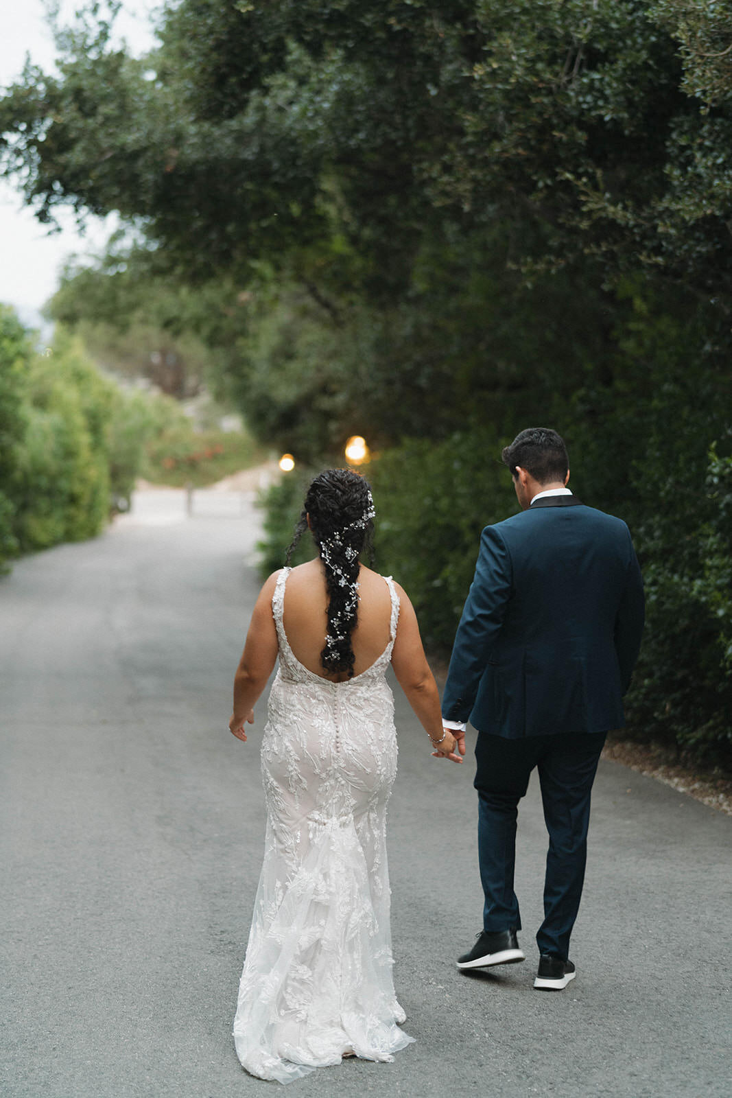 Bride and groom walking hand in hand