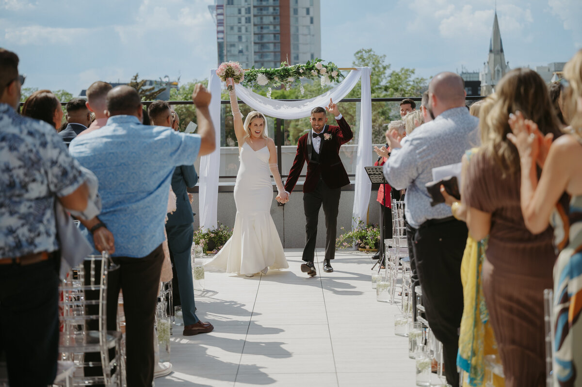 couple celebrating marriage on yeg rooftop