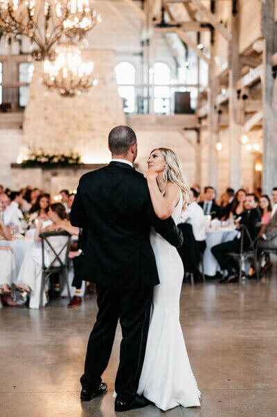 Husband and wife dance by wedding planners in chicago