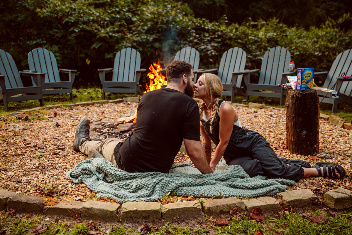 Couple photos at a campfire 