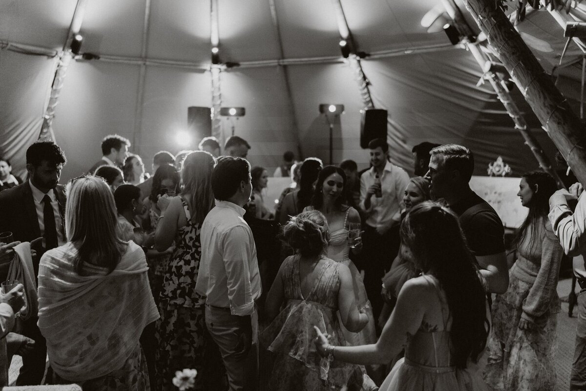 Friends and family dancing at their daughters wedding in Manorbier castle