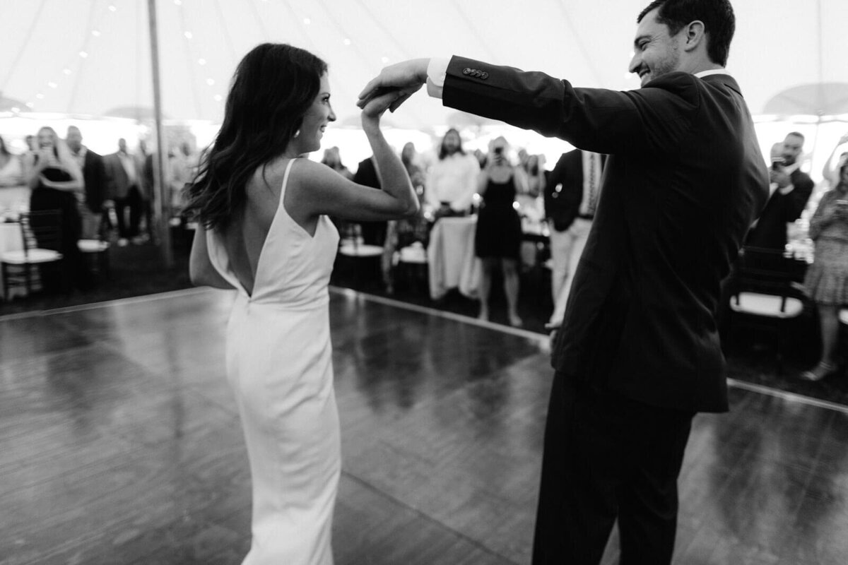 Black and white photo of the bride and groom dancing on the dance floor of Cape Cod Summer Tent, MA.