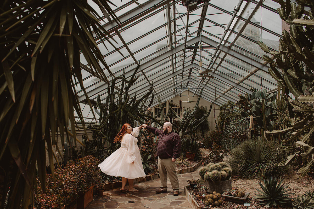A couple dancing in a conservatory 
