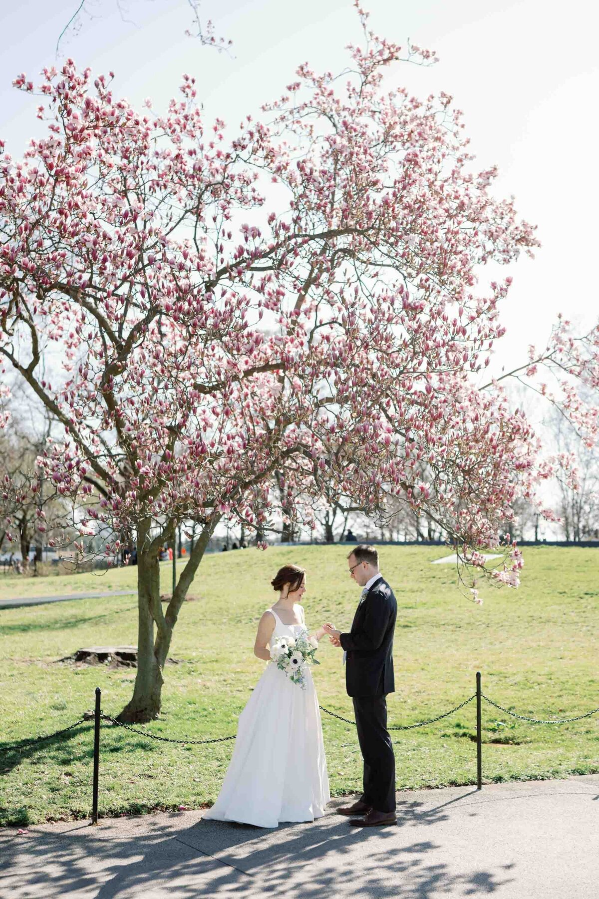 bride and groom at Washington DC  monument wedding with cherry blossoms