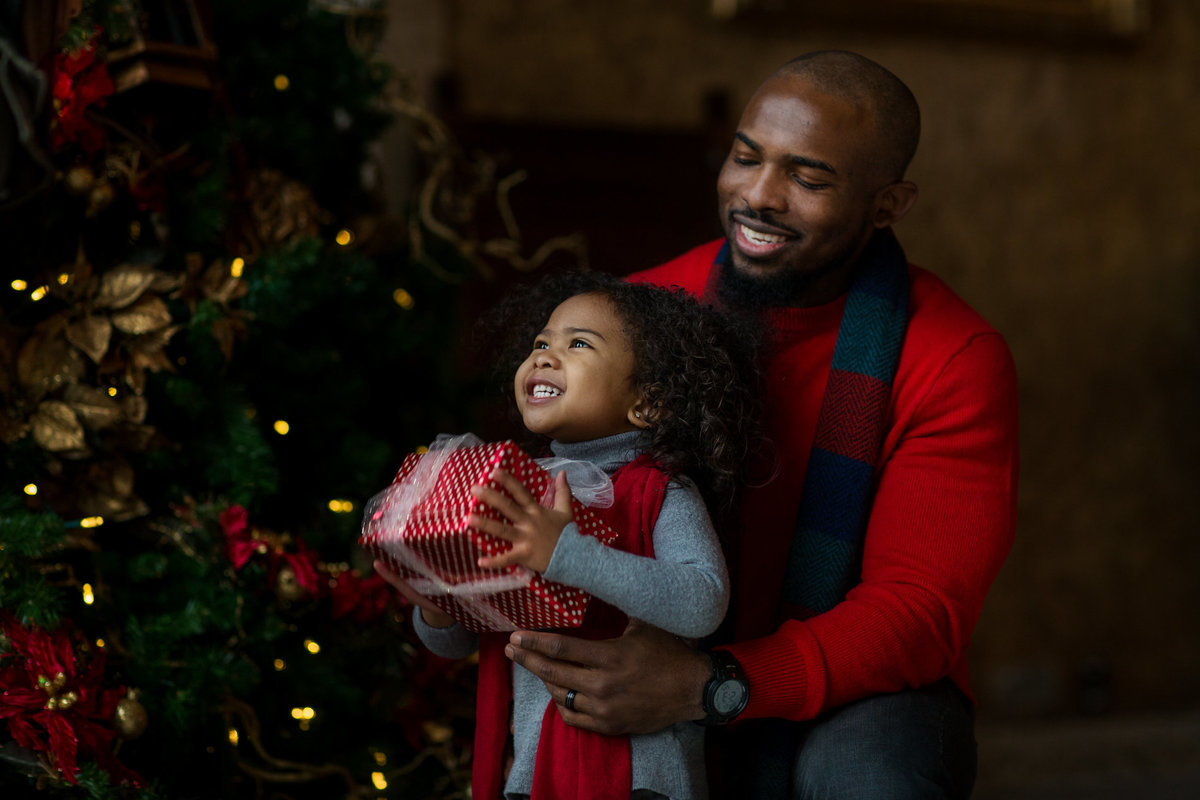 Father and daughter in Banff at Christmas with a gift