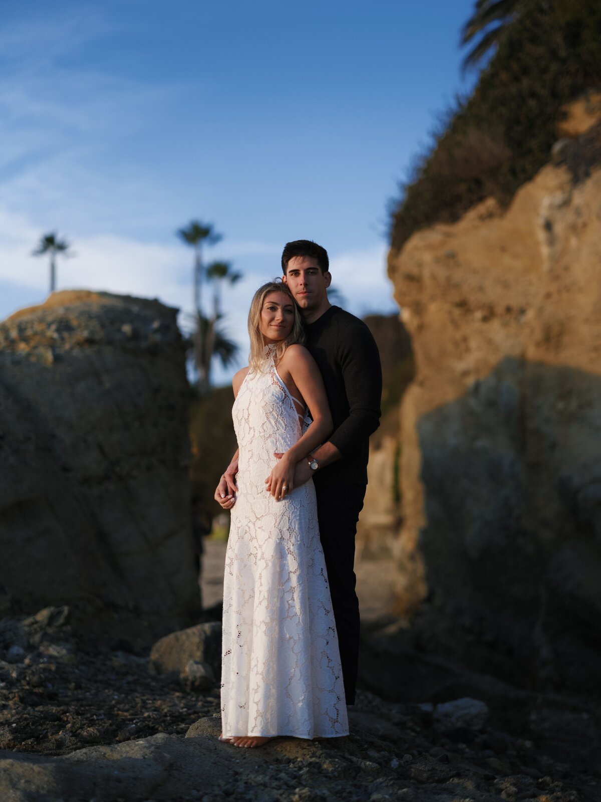 Couple standing together at sunset in Laguna Beach