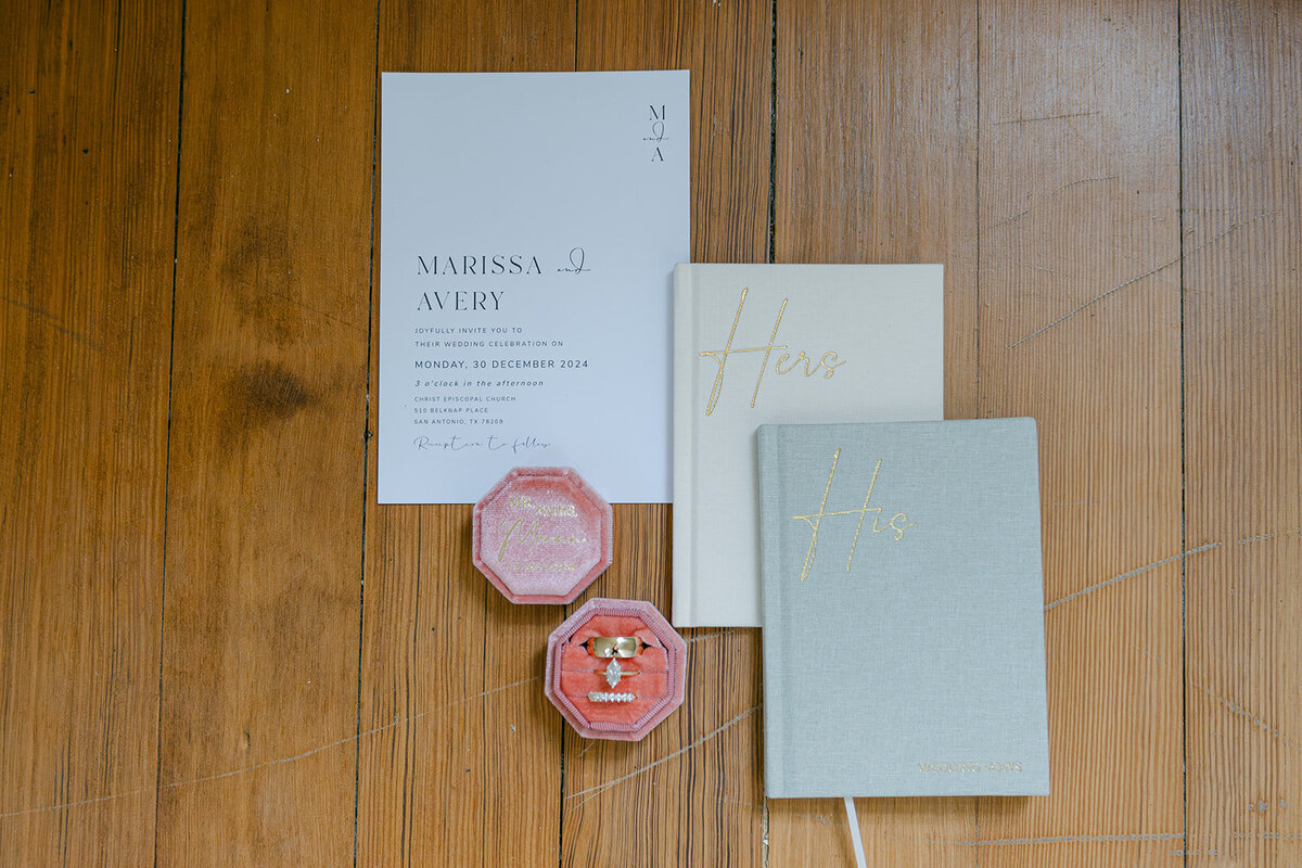 Flat lay of invitation suite with ribbon and wax seal styled for an editorial wedding in San Antonio